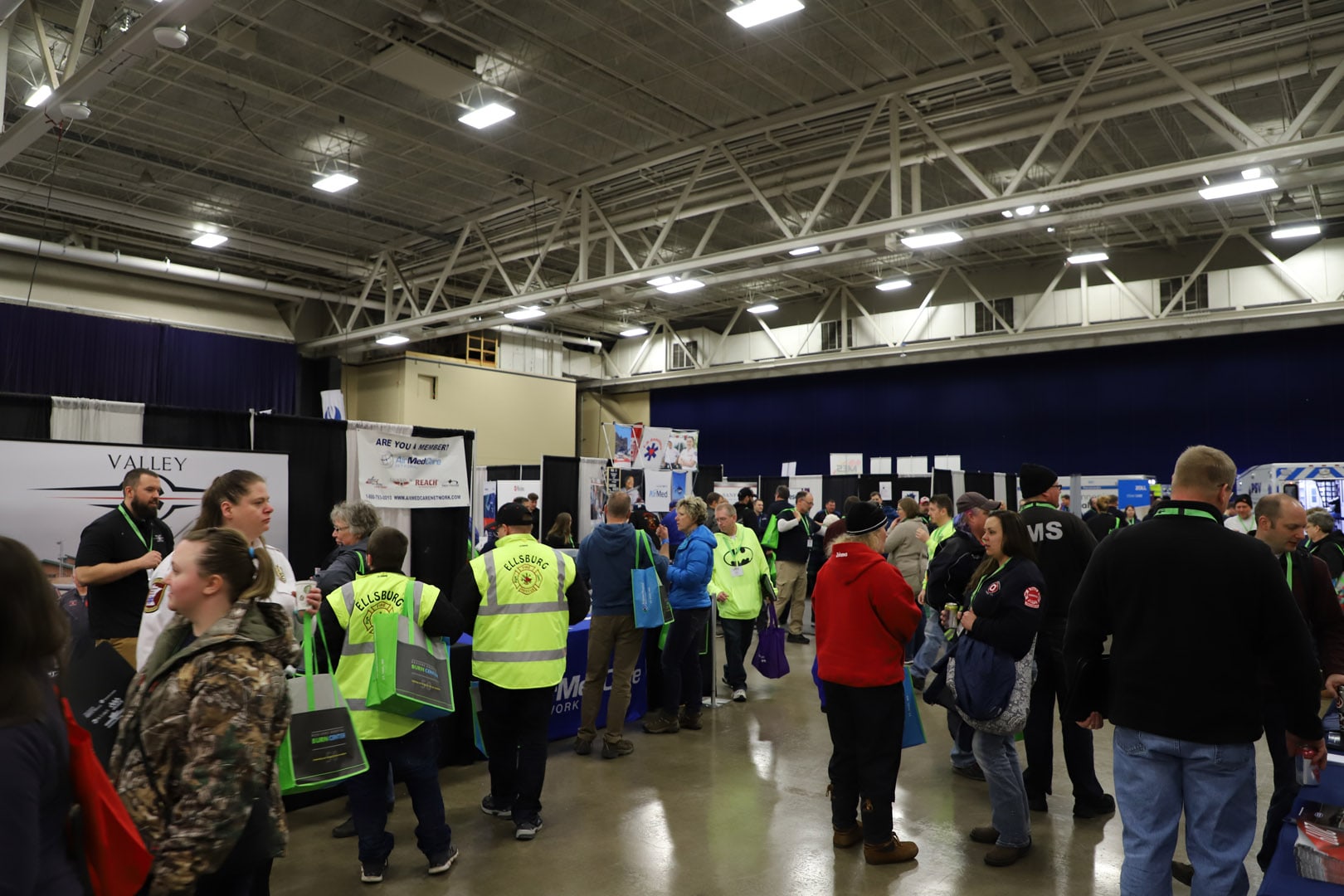 People at the expo visiting booths.